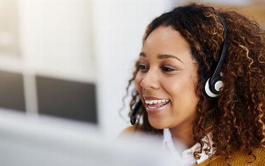 lady talking on headset while smiling